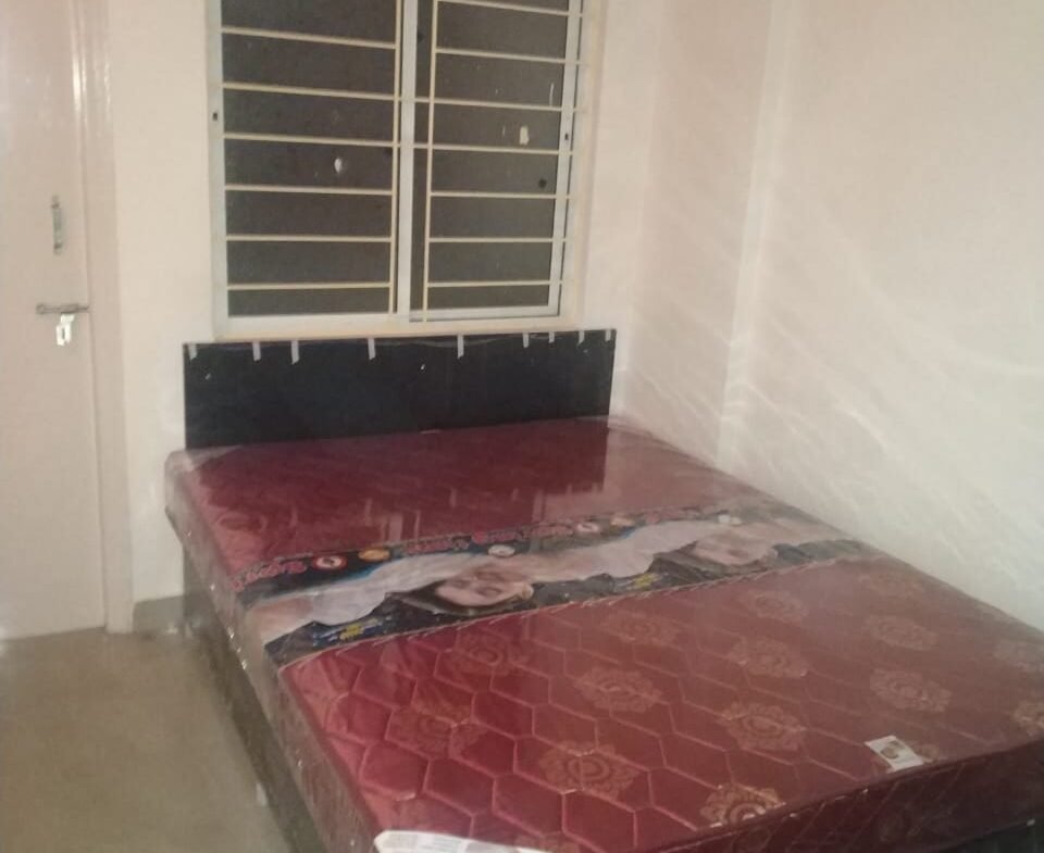 "Spacious 800 sqft 2BHK Flat for rent in BTM Layout 2nd Stage | Modern Construction & Excellent Ventilation | Ample Bike Parking Available" Bedroom https://renthouzz.in/