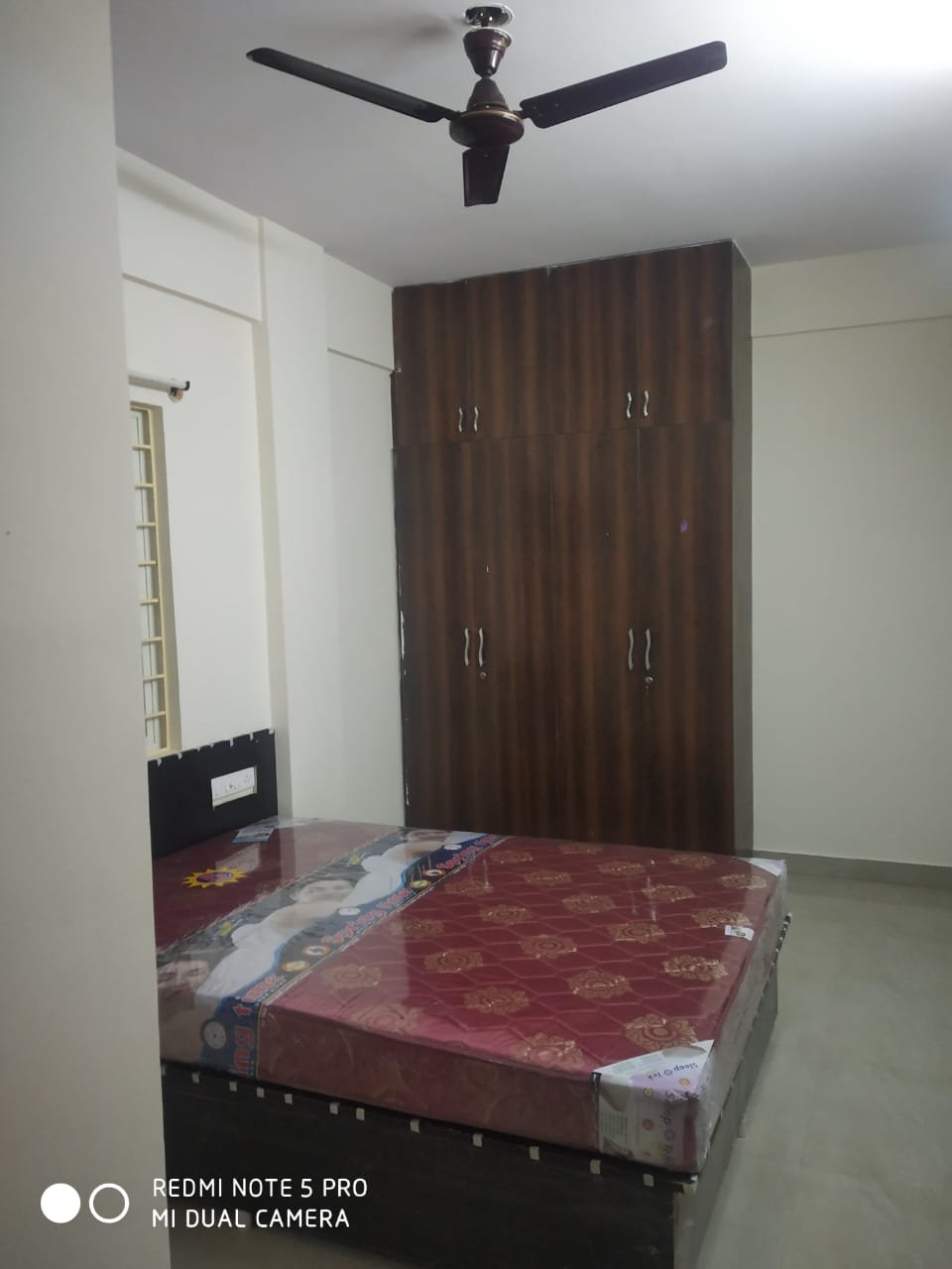 "Spacious 800 sqft 2BHK Flat for rent in BTM Layout 2nd Stage | Modern Construction & Excellent Ventilation | Ample Bike Parking Available" Bedroom https://renthouzz.in/