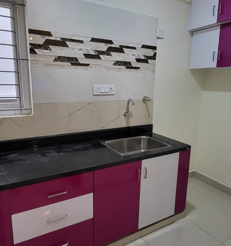 Modern Kitchen with cabinets in fully furnished 1bhk flat