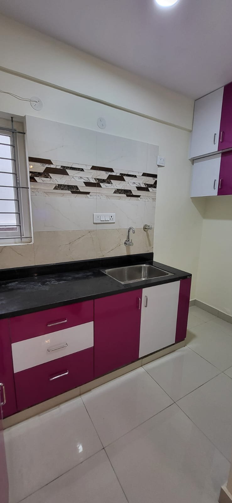 Modern Kitchen with cabinets in fully furnished 1bhk flat