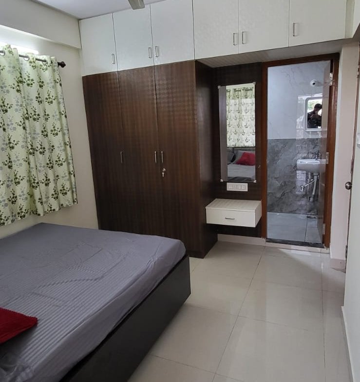 Bed and matters with cupboard in fully furnished 1bhk flat