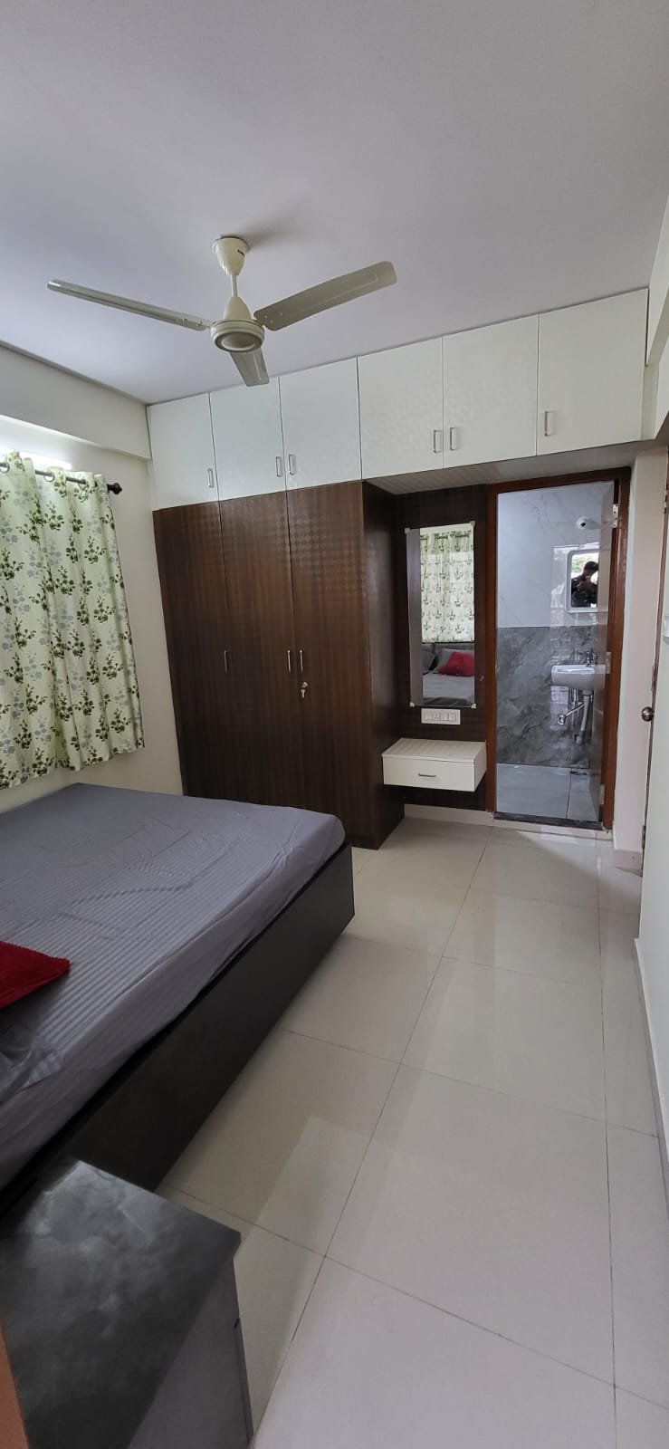 Bed and matters with cupboard in fully furnished 1bhk flat