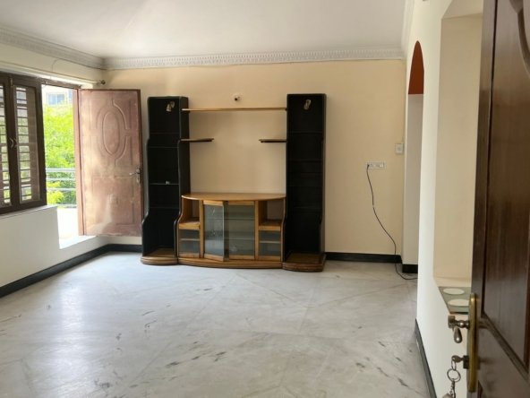 2BHK apartment living room with TV unit and balcony in Hsr Layout, Bangalore – Renthouzz