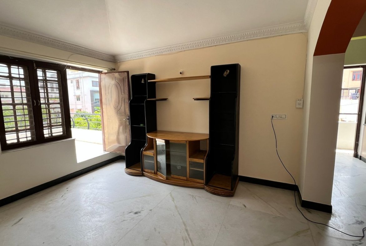 2BHK apartment living room TV unit and balcony in HSR Layout, Bangalore – Renthouzz