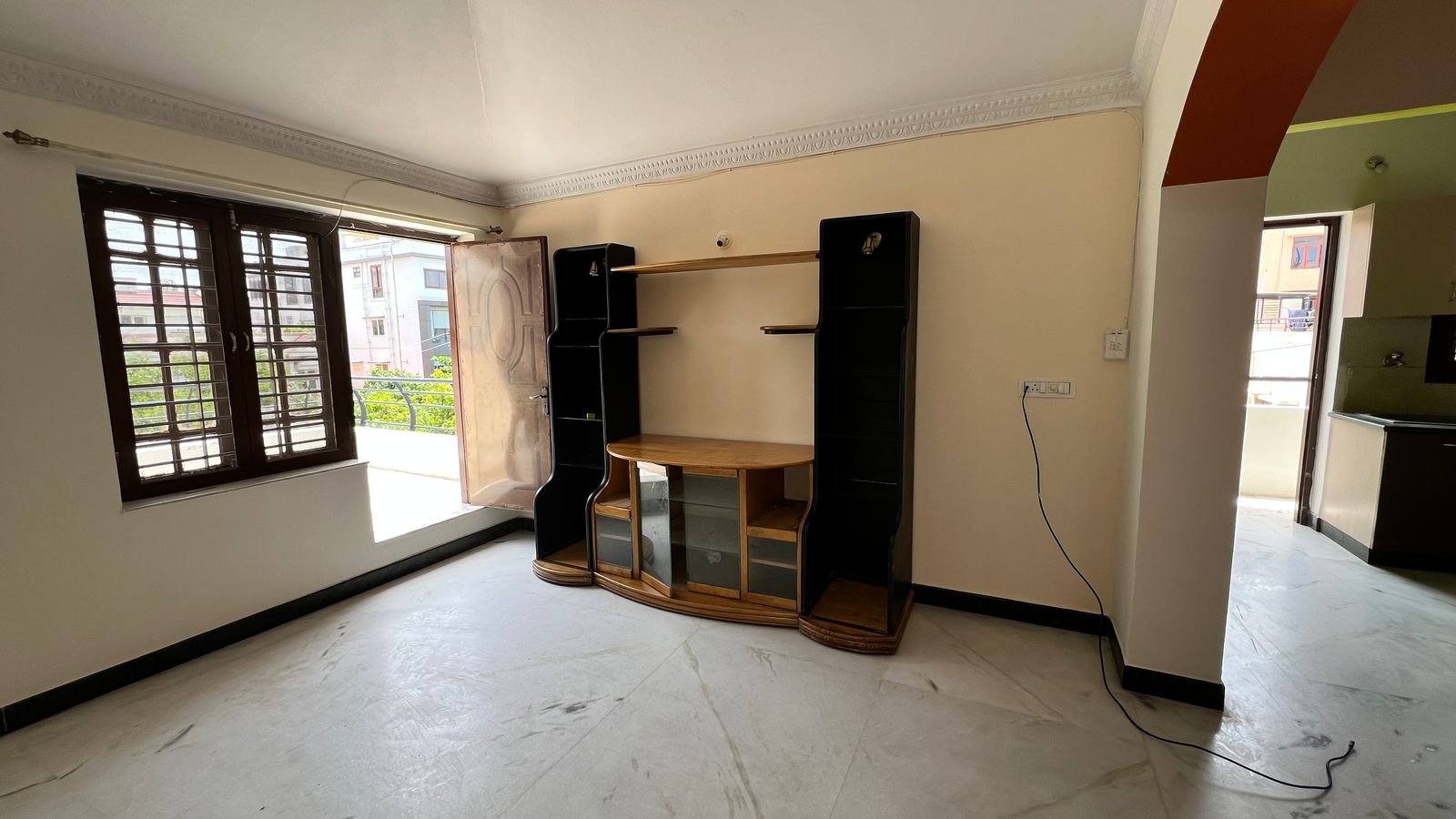 2BHK apartment living room TV unit and balcony in HSR Layout, Bangalore – Renthouzz