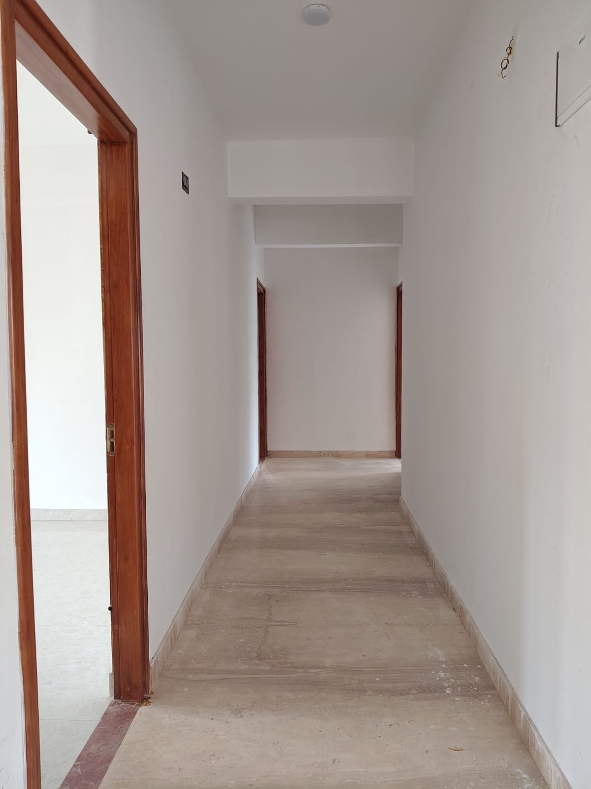 Common passage inside brand new 3BHK flat connecting hall to bedrooms in JP Nagar 8th Phase Bangalore