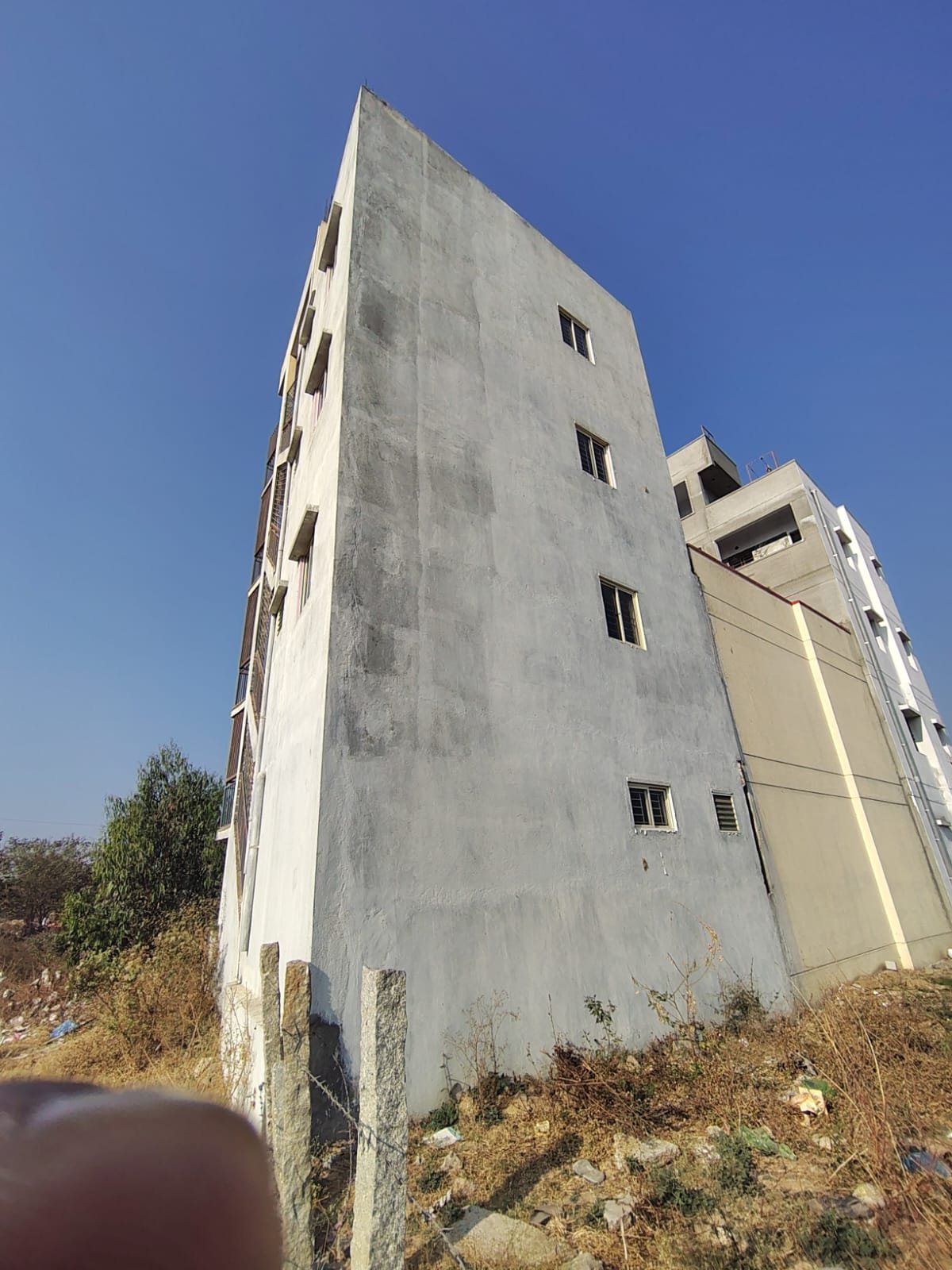 Independent G+3 Rental Income Building for Sale in Begur Near Vittasandra Main Road Exterior view of newly constructed G+3 rental income building on 20x30 plot in Balaji Layout near Vittasandra Main Road, Begur, Bengaluru