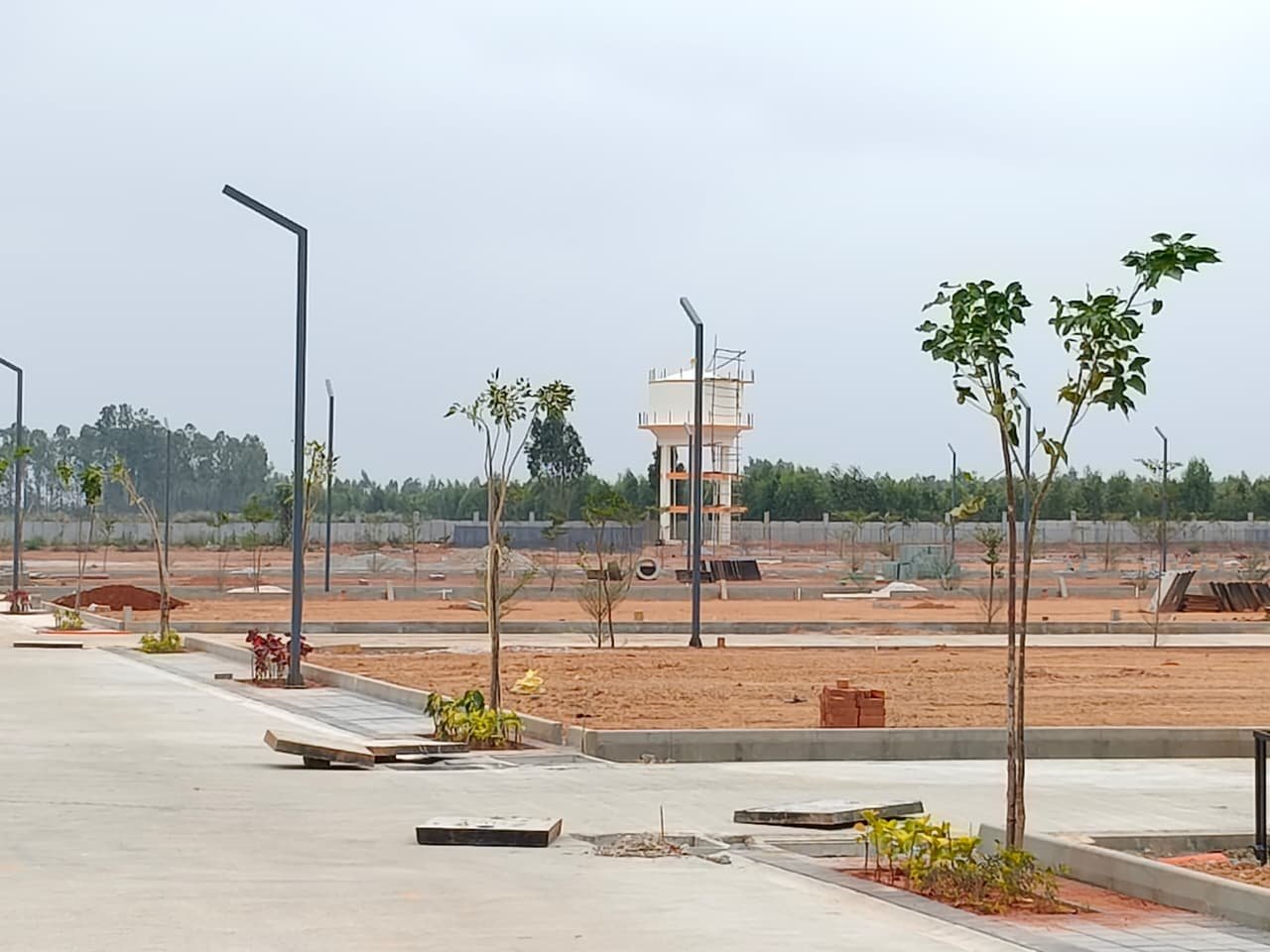 Master layout plan of BMRDA approved villa plots in Jigani near Electronic City Bangalore with roads, green spaces and premium plotted development.