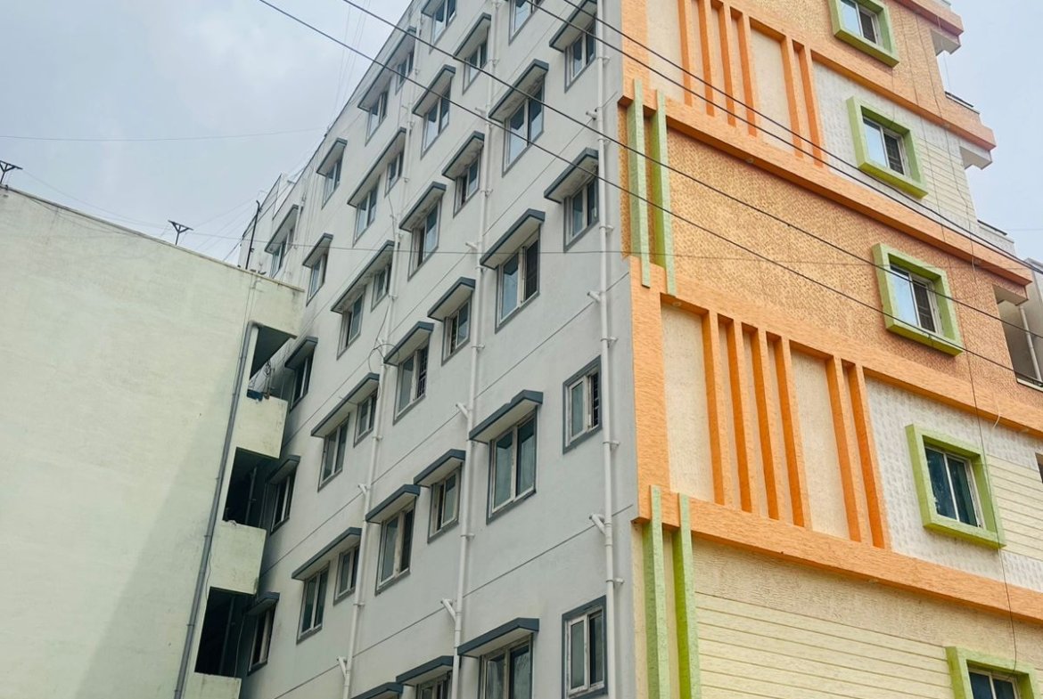 Exterior view of G+6 rental income building with 38 units and commercial shops in Electronic City Phase 2 Bangalore generating ₹3.2 lakh monthly rent