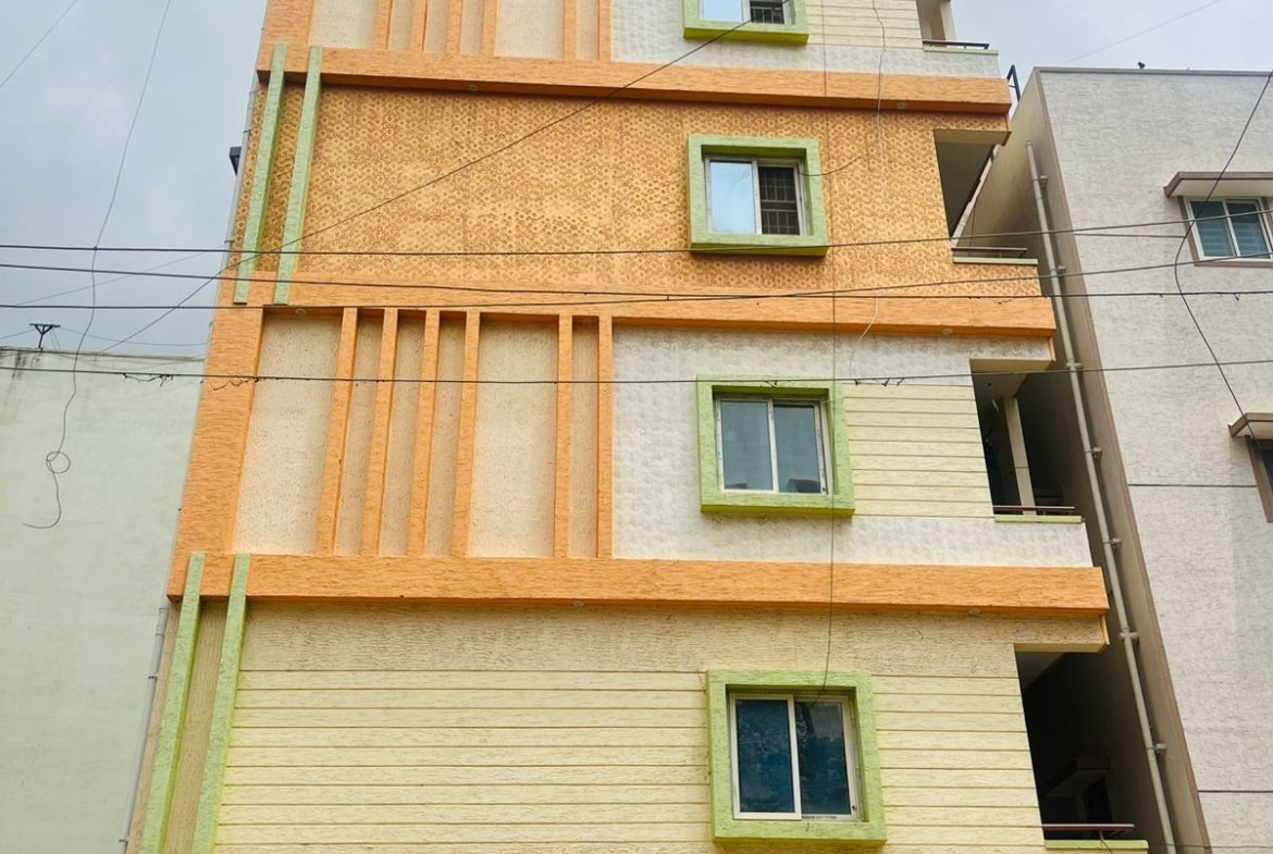 Exterior view of G+6 rental income building with 38 units and commercial shops in Electronic City Phase 2 Bangalore generating ₹3.2 lakh monthly rent