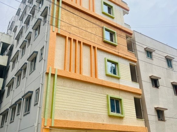 Exterior view of G+6 rental income building with 38 units and commercial shops in Electronic City Phase 2 Bangalore generating ₹3.2 lakh monthly rent