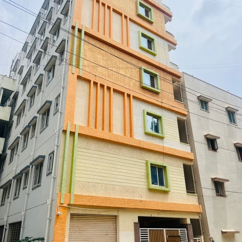 Exterior view of G+6 rental income building with 38 units and commercial shops in Electronic City Phase 2 Bangalore generating ₹3.2 lakh monthly rent