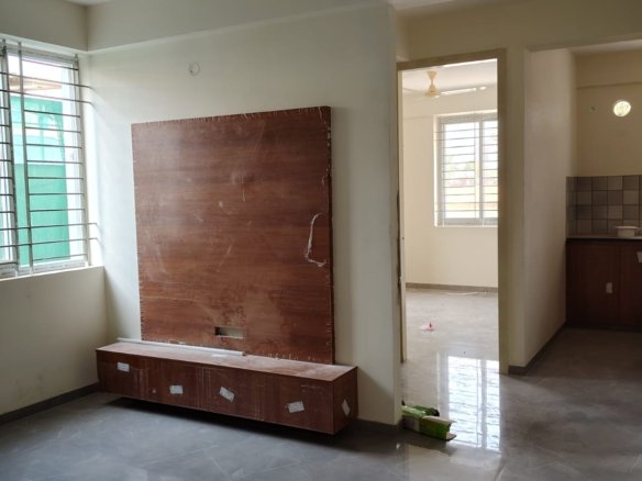 living room 1BHK fully furnished flat for rent BTM Layout sofa TV setup