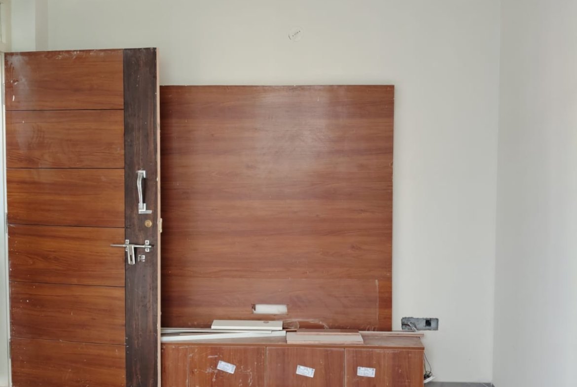 living room 1BHK fully furnished flat for rent BTM Layout sofa TV setup