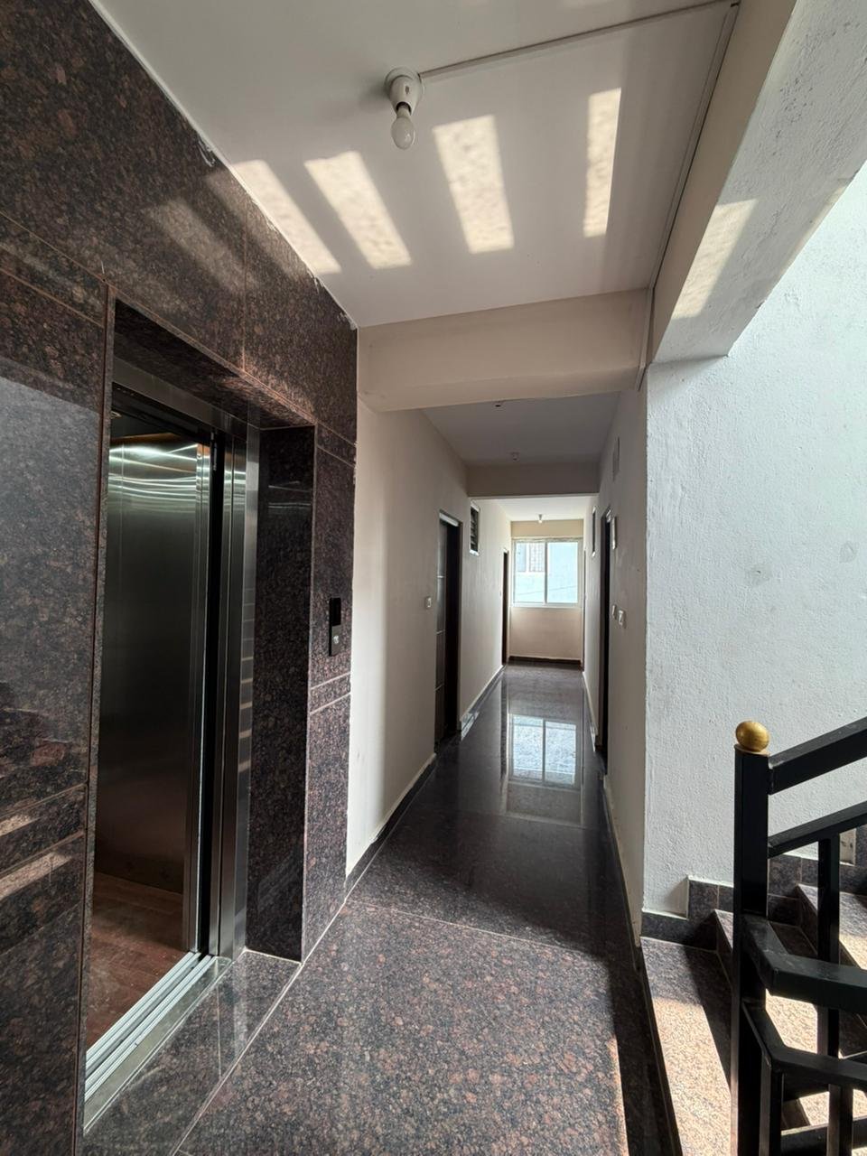 staircase area in PG building for sale in Marathahalli Bangalore well ventilated common area