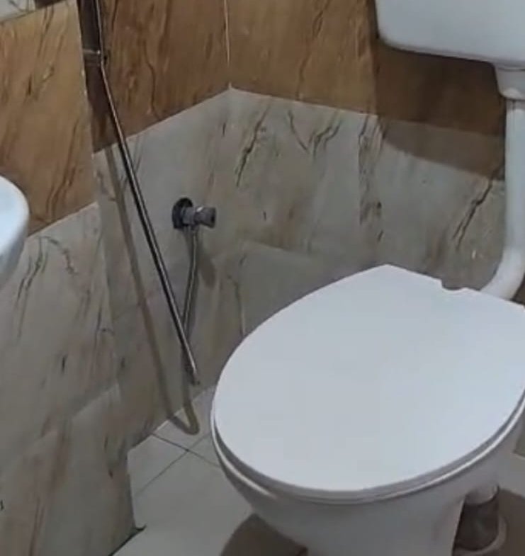 Premium attached washroom with shower geyser tiles and modern fittings in Christ University PG