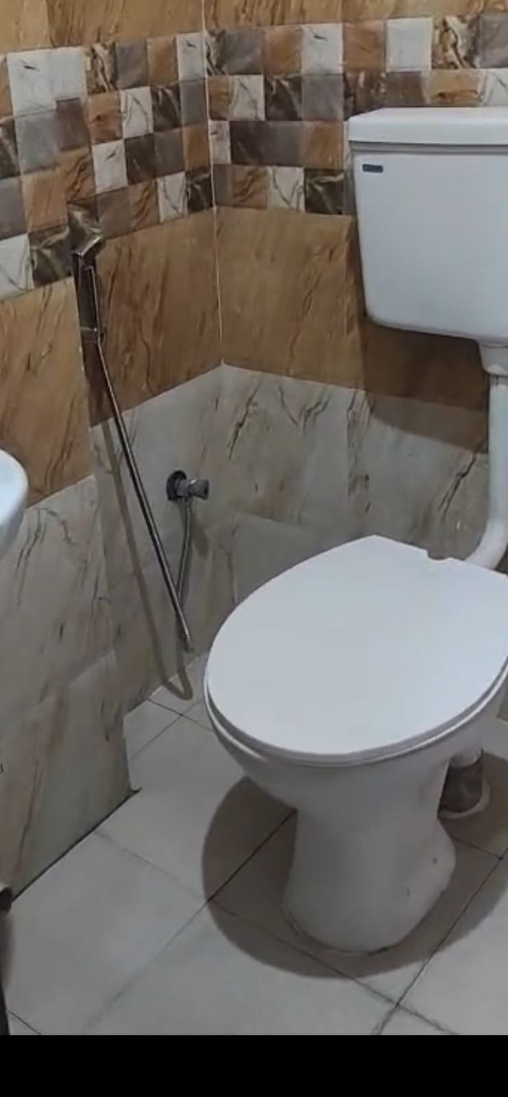 Premium attached washroom with shower geyser tiles and modern fittings in Christ University PG