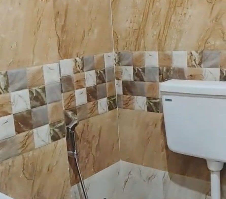 Premium attached washroom with shower geyser tiles and modern fittings in Christ University PG