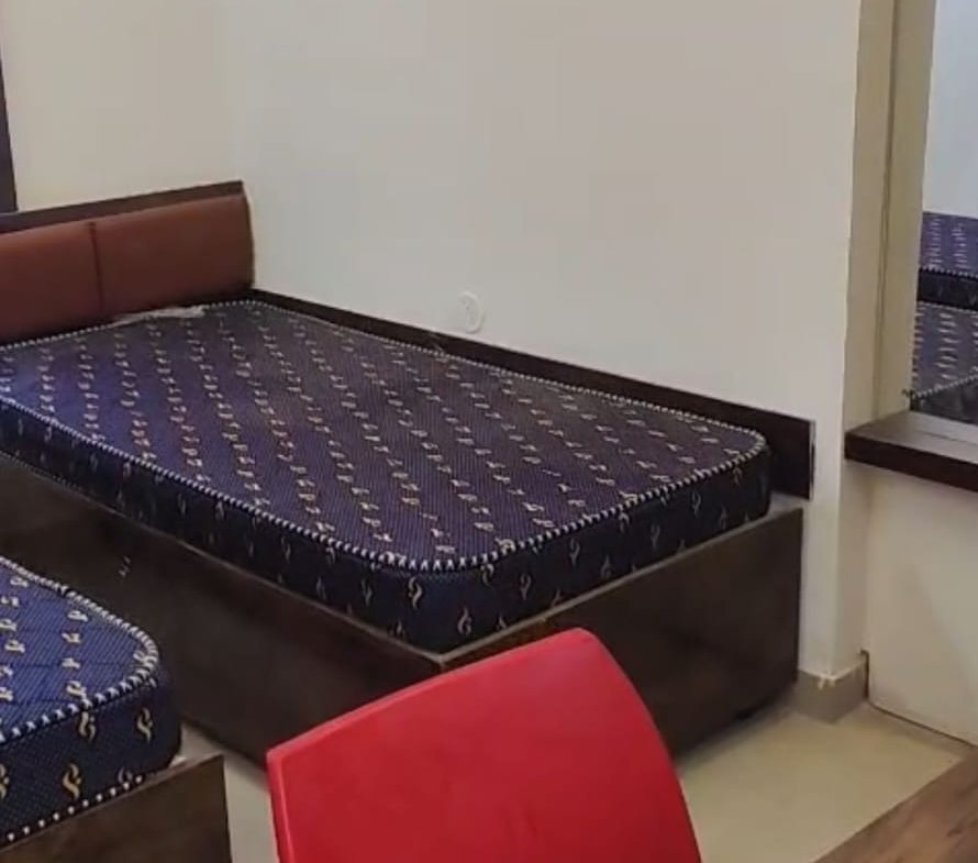 Modern furnished single room in new G+6 PG building SG Palya with bed wardrobe desk and attached bathroom