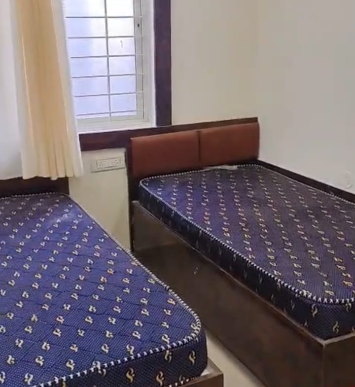 Modern furnished single room in new G+6 PG building SG Palya with bed wardrobe desk and attached bathroom