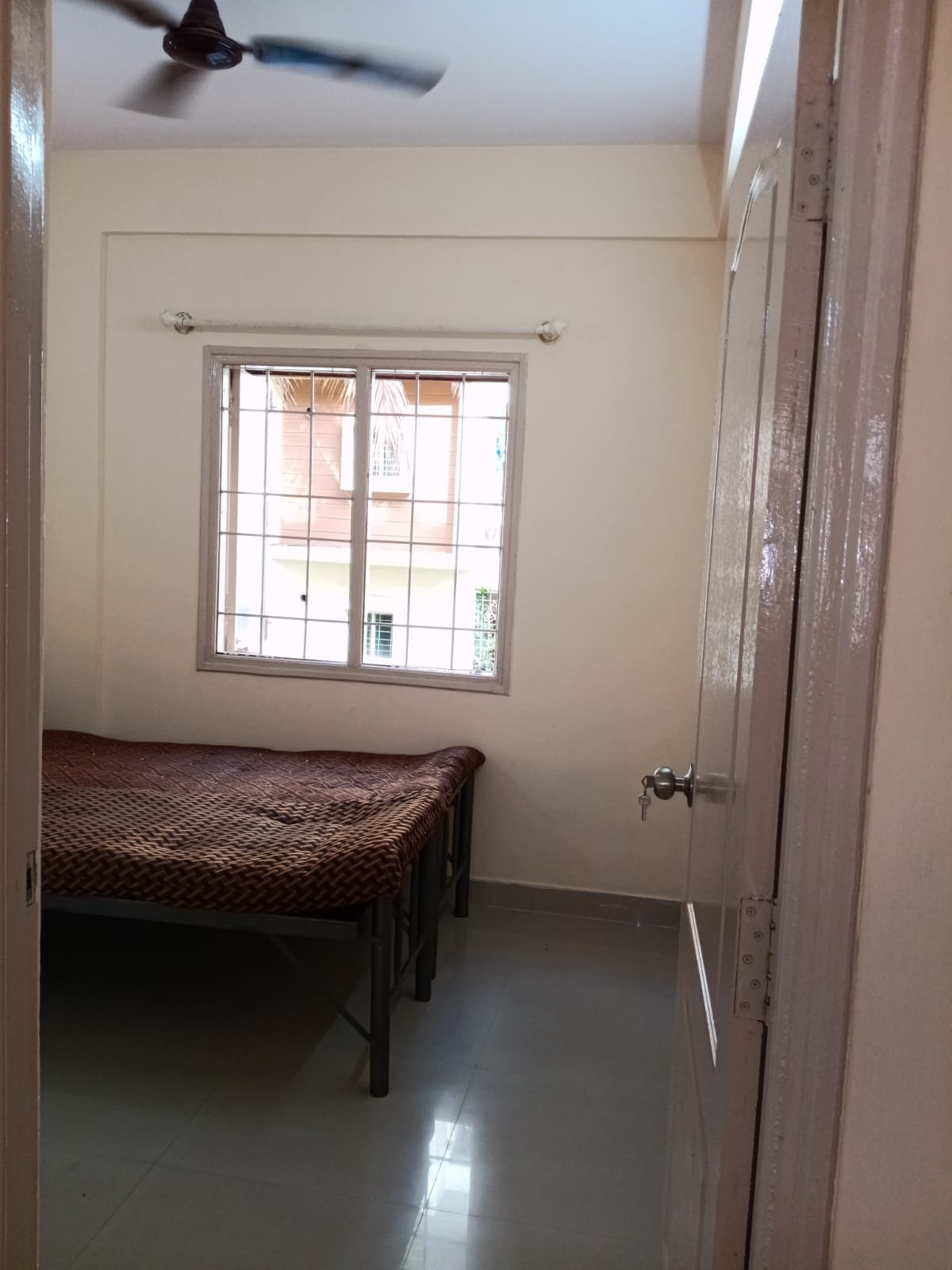 Bedroom with king size bed, mattress, wardrobe and natural light in 2BHK apartment