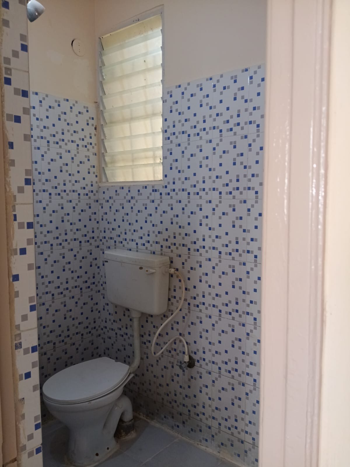 Western bathroom with geyser, shower and wash basin in furnished 2BHK flat