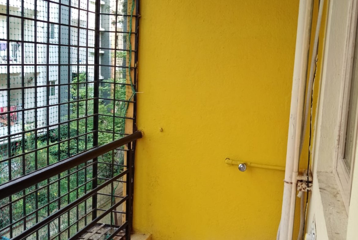 Balcony with open view and safety grills in KB Eco City apartment
