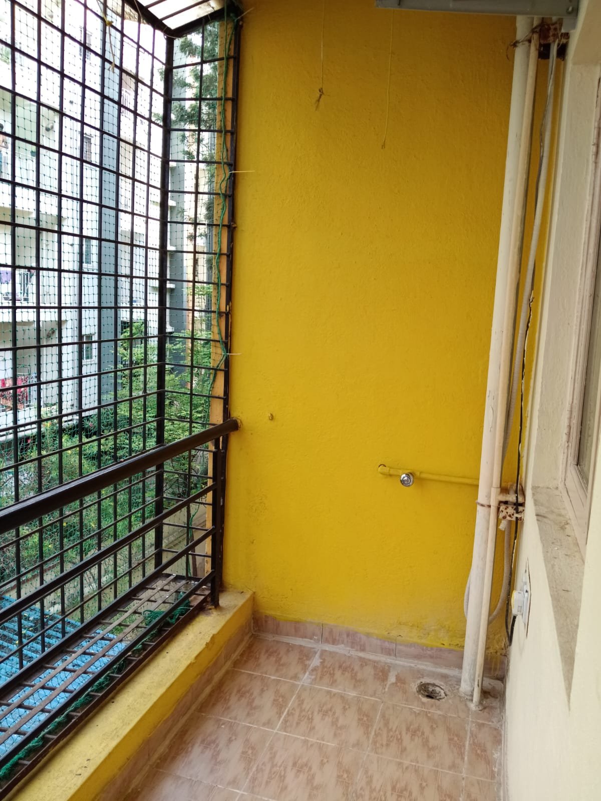 Balcony with open view and safety grills in KB Eco City apartment