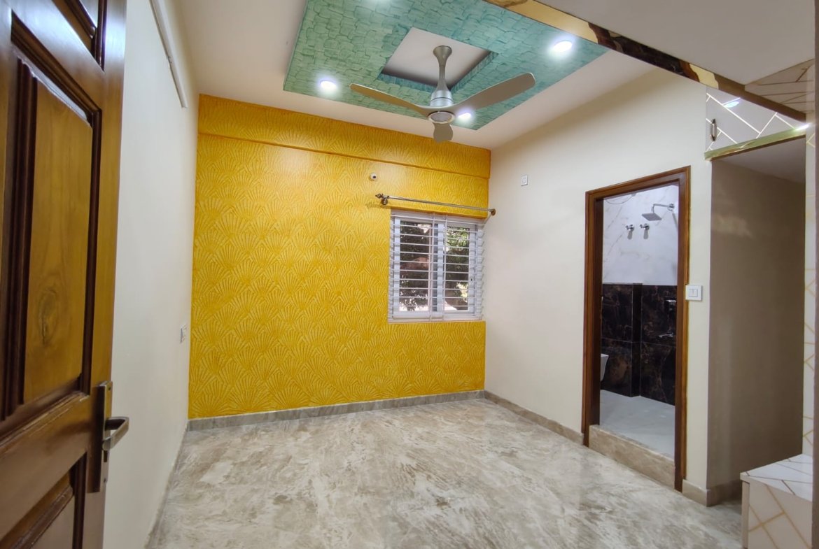 Bedroom with wardrobe in semi furnished 2BHK apartment for rent in HSR Layout Sector 1 Bangalore