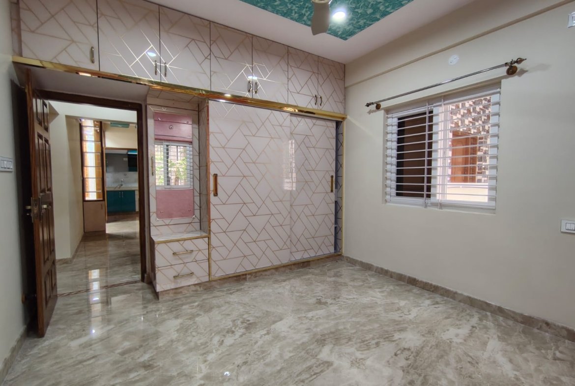 Bedroom with wardrobe in semi furnished 2BHK apartment for rent in HSR Layout Sector 1 Bangalore