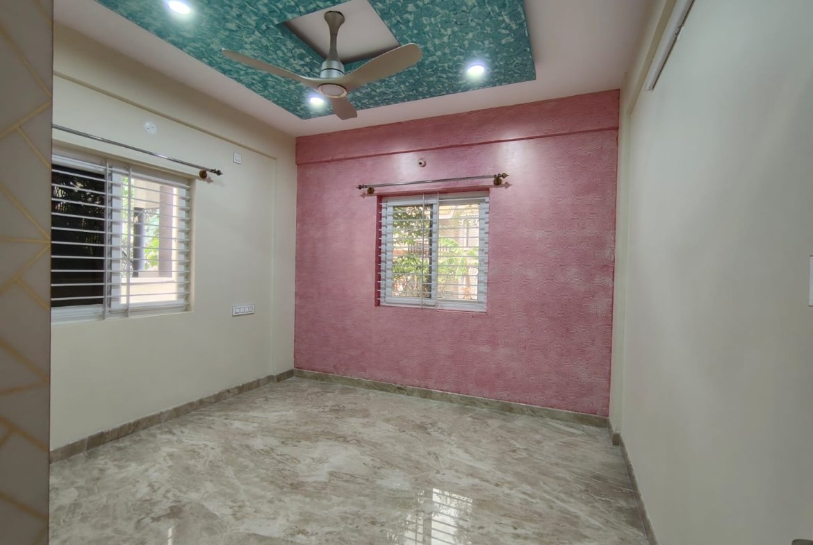 Bedroom with wardrobe in semi furnished 2BHK apartment for rent in HSR Layout Sector 1 Bangalore