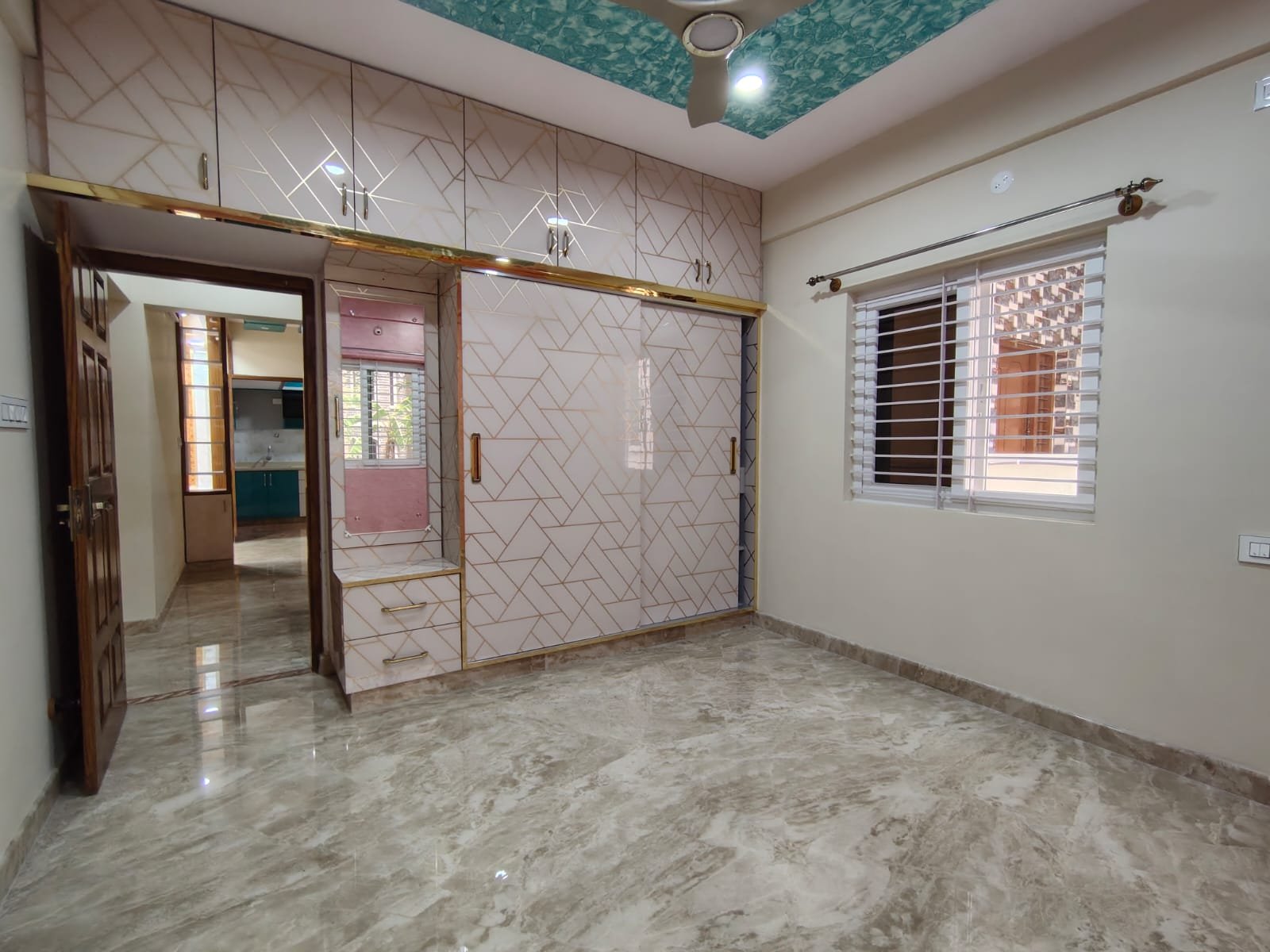 Bedroom with wardrobe in semi furnished 2BHK apartment for rent in HSR Layout Sector 1 Bangalore