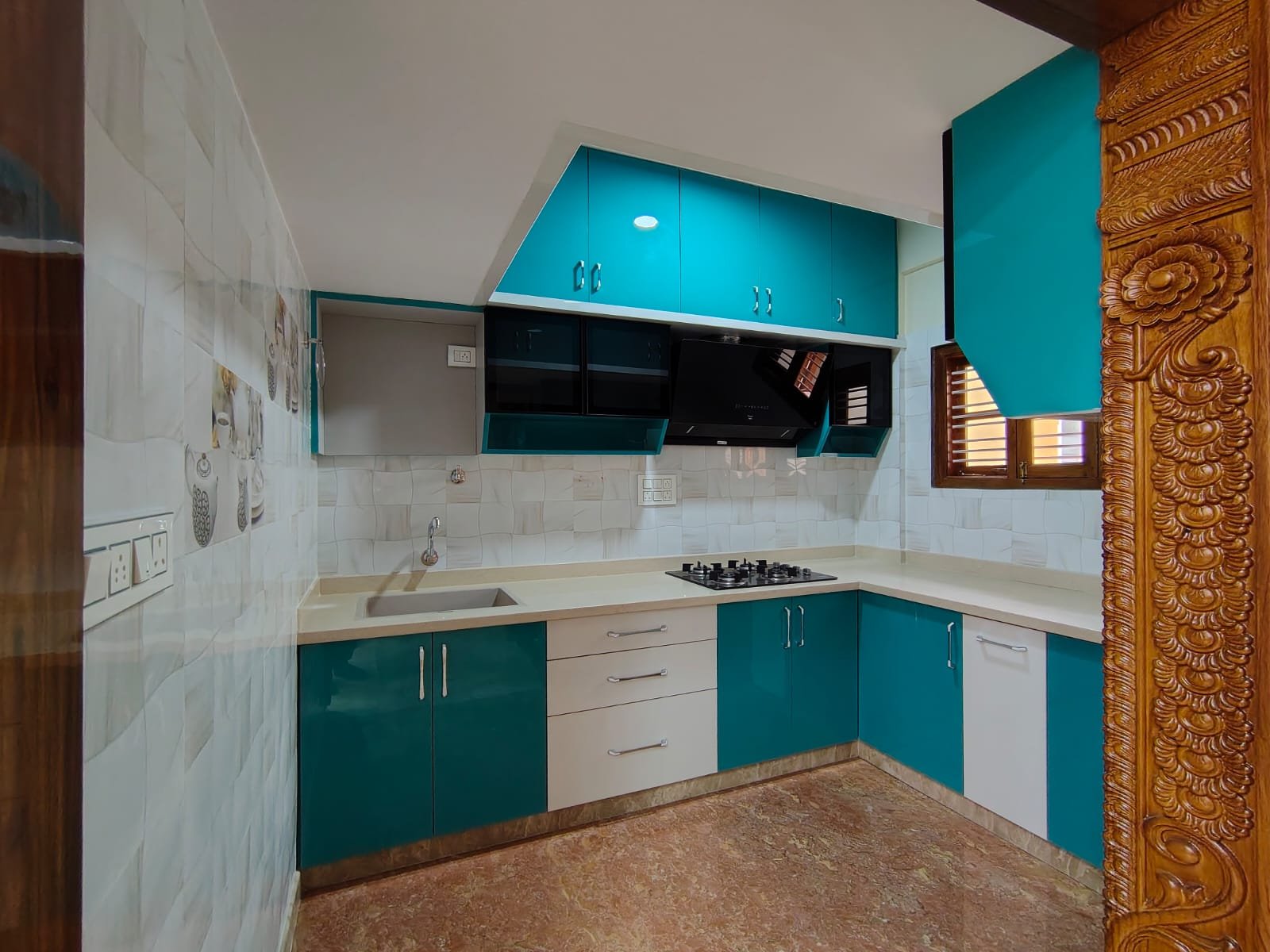 Modular kitchen with cabinets and chimney in 2BHK flat for rent in HSR Layout Sector 1 Bangalore