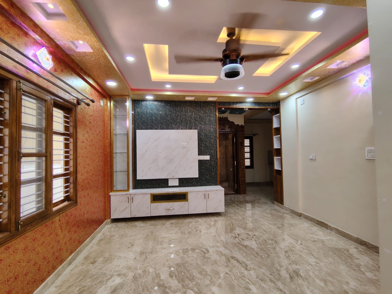 Spacious living room of semi furnished 2BHK flat in HSR Layout Sector 1 Bangalore with natural light and ventilation