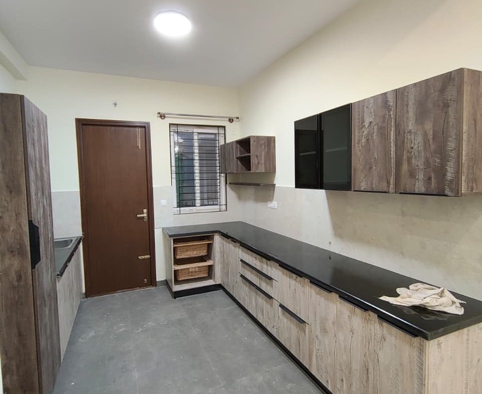 Modern modular kitchen with cabinets in Woodsvale villa Sarjapura