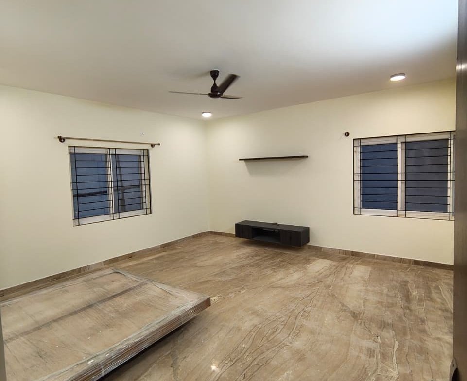Master bedroom with wardrobe and attached bathroom in Woodsvale villa