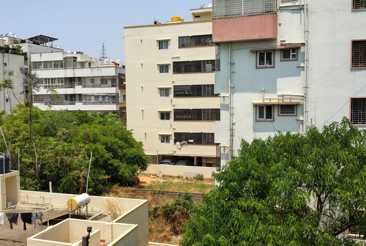 Spacious balcony view in 3BHK apartment with open ventilation and natural light