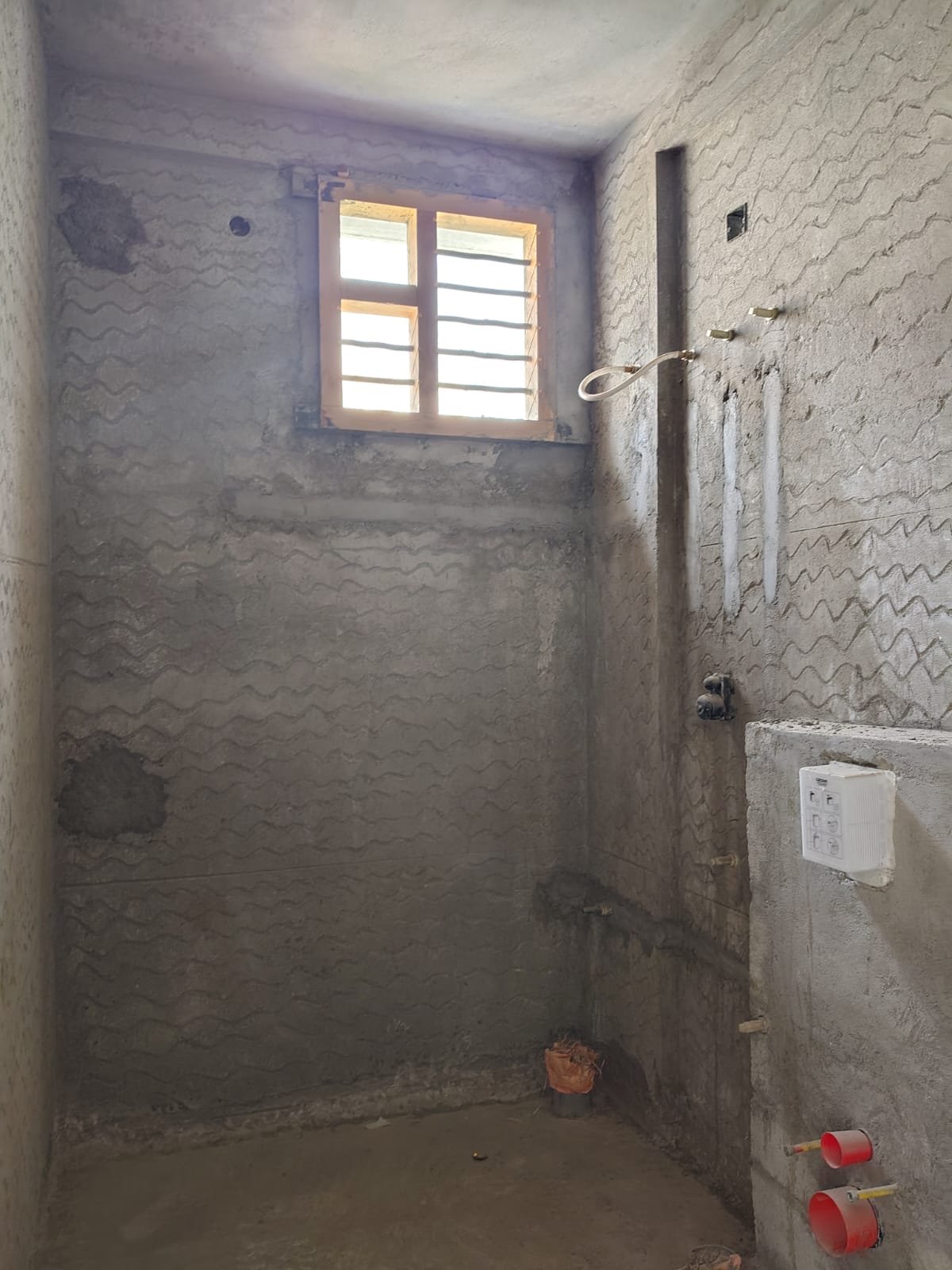 Modern bathroom with premium fittings and wall tiles in residential apartment