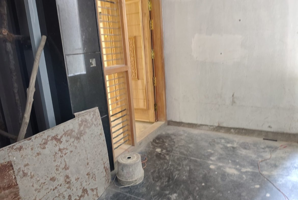 Modern passenger lift and granite finished staircase in apartment building