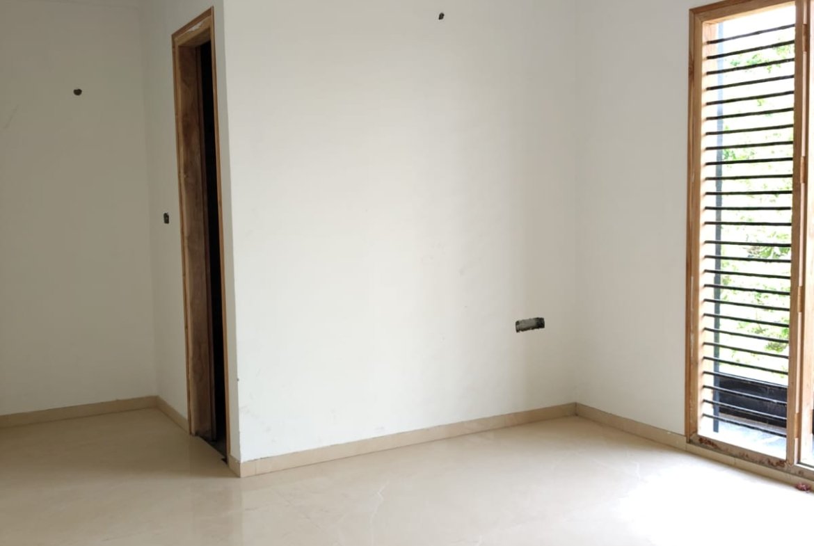 Master bedroom in 3BHK flat with balcony and natural ventilation