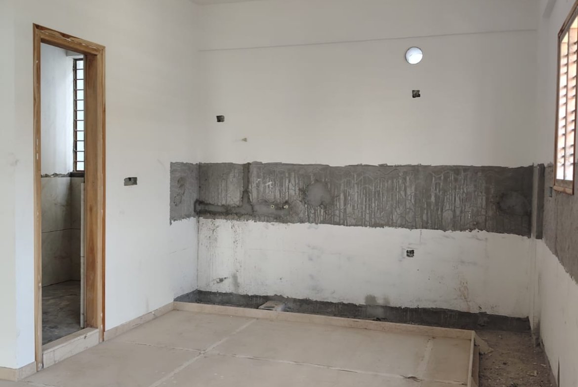 Modular kitchen design with granite platform and stainless steel sink in 3BHK flat