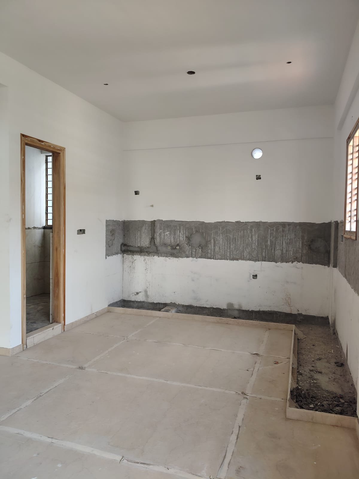 Modular kitchen design with granite platform and stainless steel sink in 3BHK flat