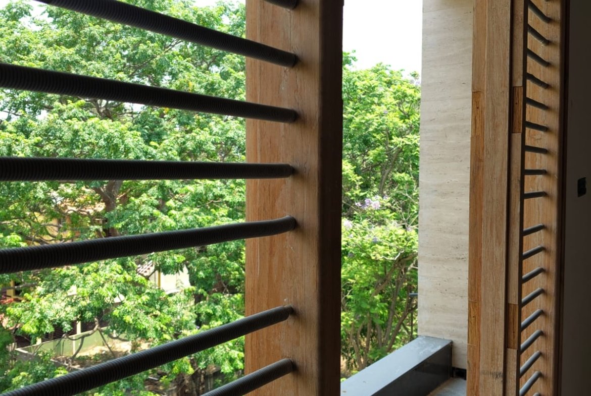 Spacious balcony view in 3BHK apartment with open ventilation and natural light