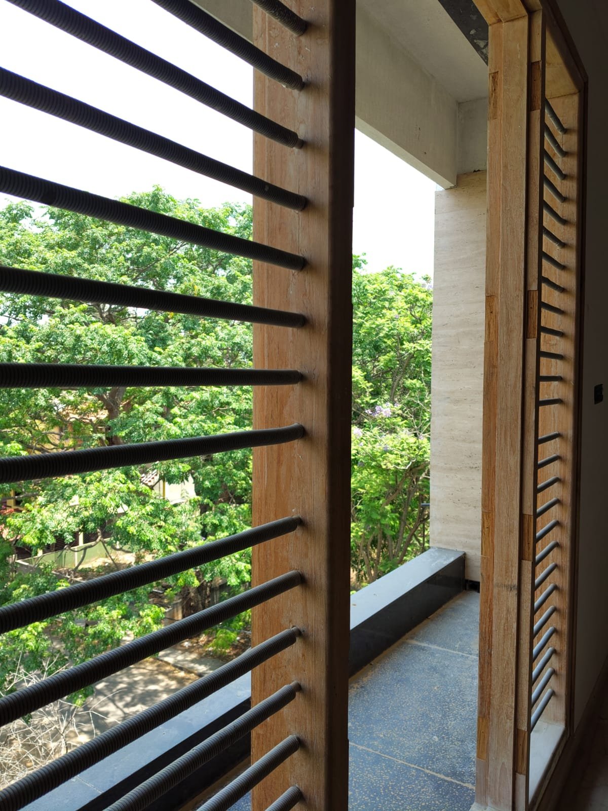 Spacious balcony view in 3BHK apartment with open ventilation and natural light