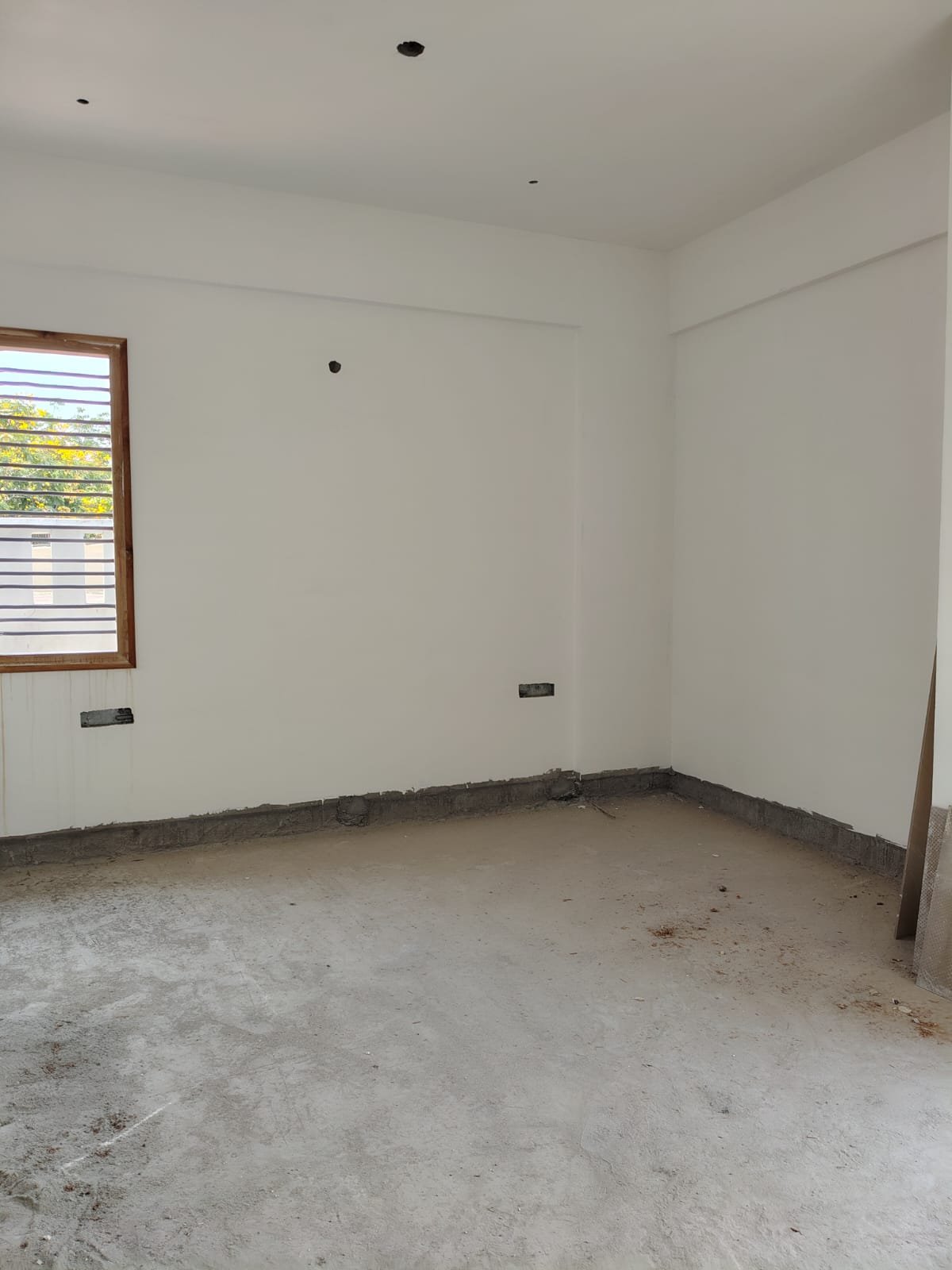 Master bedroom in 3BHK flat with balcony and natural ventilation