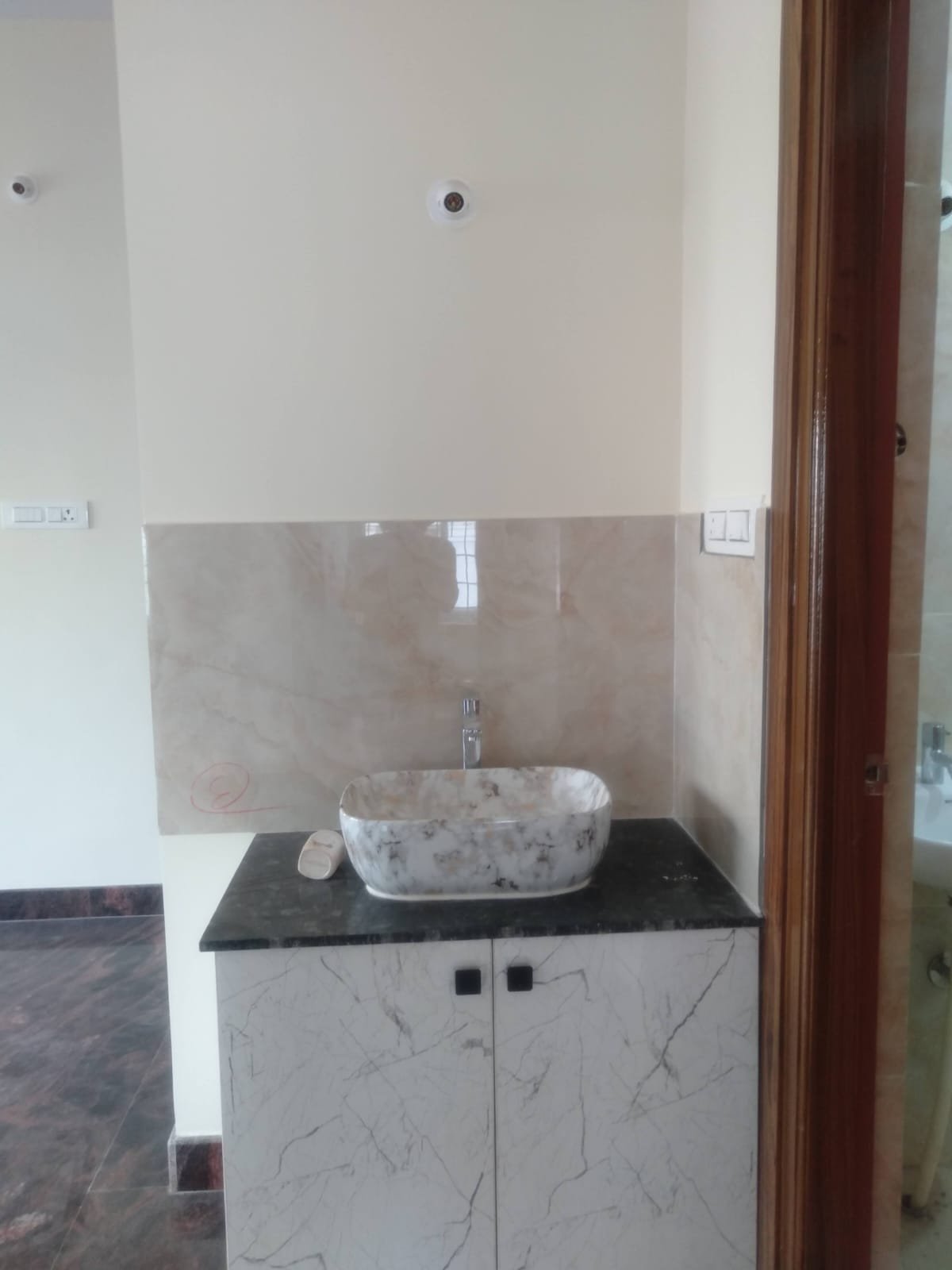 Modern 2BHK washroom with premium fittings anti-slip tiles and ample storage near Bannerghatta Main Road.