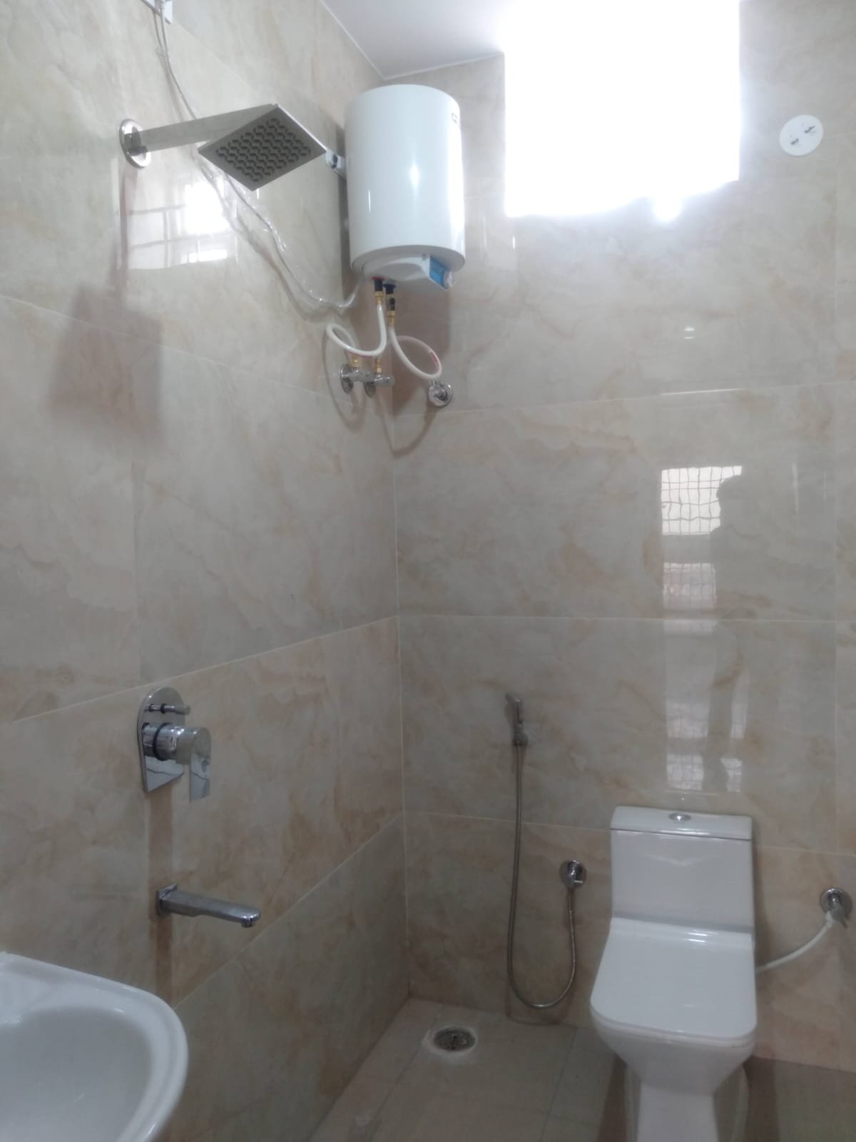 Modern 2BHK washroom with premium fittings anti-slip tiles and ample storage near Bannerghatta Main Road.