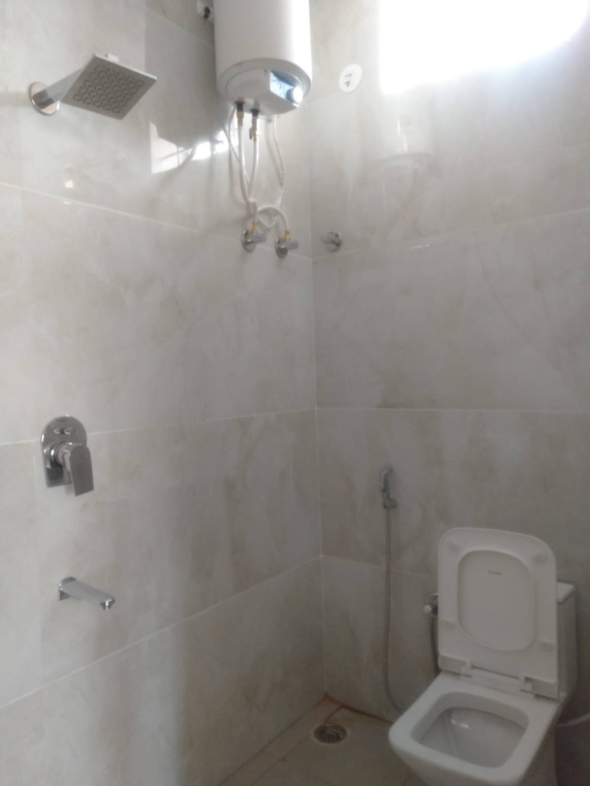 Modern 2BHK washroom with premium fittings anti-slip tiles and ample storage near Bannerghatta Main Road.