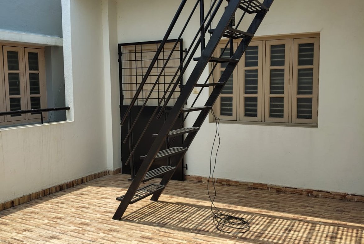 Secure grilled iron entrance door of 1BHK flat in Bannerghatta Road Bangalore