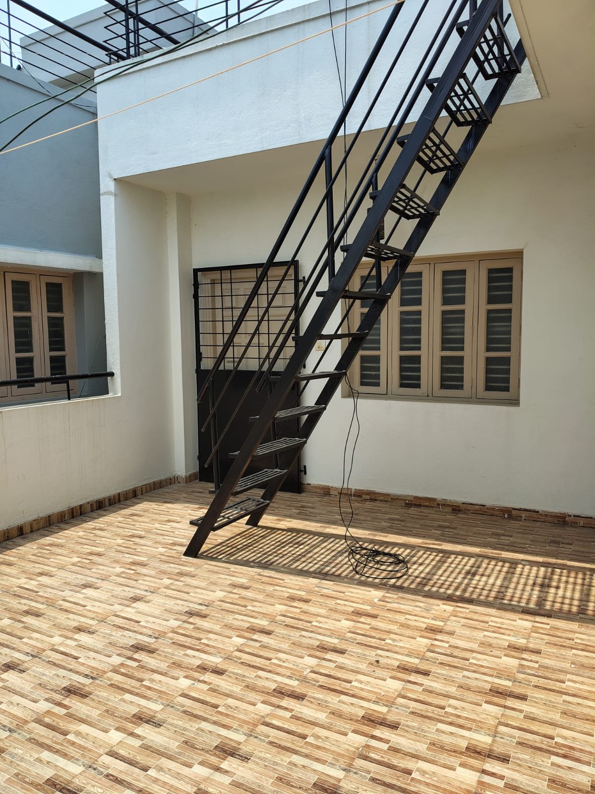 Secure grilled iron entrance door of 1BHK flat in Bannerghatta Road Bangalore